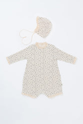 Front view of the Lumiere Bodysuit in Olive Rose – a long-sleeve baby romper with a subtle floral print and lace accents.